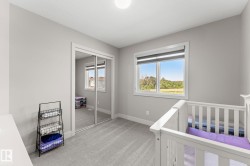Light gray carpeting complements pale wall finishes - 