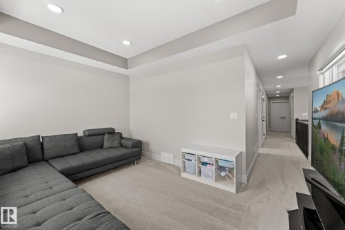 Recessed lighting illuminates the tray ceiling and light-toned walls - 12383 176 Avenue Nw, Edmonton, AB - Indoor