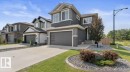 Modern two-story home featuring a striking contemporary exterior with mixed siding finishes, peaked roofline with gabled detailing, and multiple windows providing abundant natural light - 12383 176 Avenue Nw, Edmonton, AB  - Indoor Photo Showing Other Room 