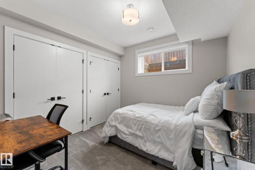 Interior room featuring a window, light gray walls, and gray carpet flooring - 12383 176 Avenue Nw, Edmonton, AB - Indoor Photo Showing Bedroom