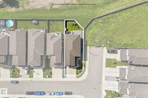 Aerial view showcasing a corner property with an expansive backyard featuring a green lawn and a small play structure - 12383 176 Avenue Nw, Edmonton, AB - Other