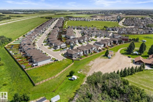 Aerial perspective showcasing a residential development with numerous detached homes - 12383 176 Avenue Nw, Edmonton, AB - Outdoor With View