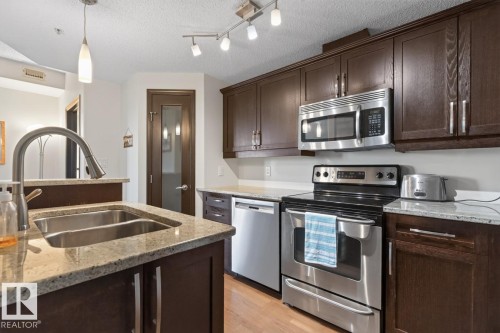#801 9707 106 St Nw, Edmonton, AB - Indoor Photo Showing Kitchen With Stainless Steel Kitchen With Double Sink