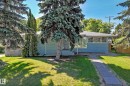 Ranch-style residence featuring blue siding and a light gray shingle roof - 12011 87 Avenue Nw, Edmonton, AB  - Outdoor 