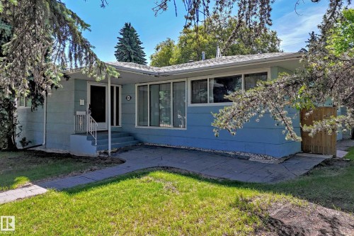 Single-story residence featuring light blue siding and a light-colored shingle roof - 12011 87 Avenue Nw, Edmonton, AB - Outdoor