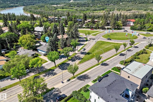 Aerial view showcasing a residential area with varied rooflines and extensive tree coverage - 12011 87 Avenue Nw, Edmonton, AB - Outdoor With View