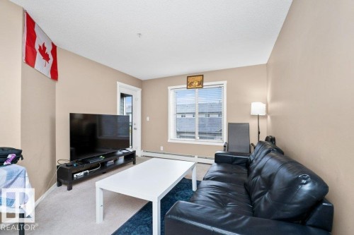 #221 111 Watt Cm Sw, Edmonton, AB - Indoor Photo Showing Living Room