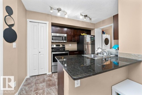 #221 111 Watt Cm Sw, Edmonton, AB - Indoor Photo Showing Kitchen With Double Sink