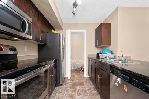 #221 111 Watt Cm Sw, Edmonton, AB - Indoor Photo Showing Kitchen With Double Sink
