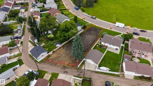 Spacious residential lot featuring mature landscaping, established trees, and cleared building area - 10513 42 Street Nw, Edmonton, AB 