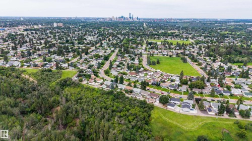 Expansive residential area featuring numerous detached homes, mature trees, and multiple green spaces - 10513 42 Street Nw, Edmonton, AB 