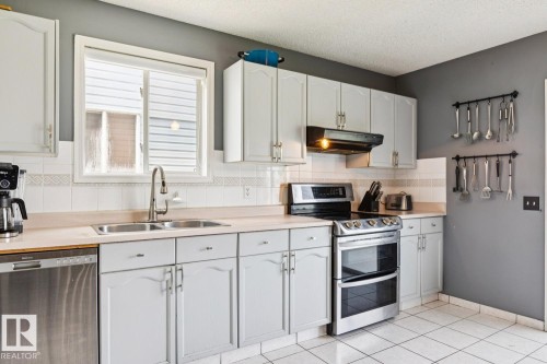 7912 154 Avenue Nw, Edmonton, AB - Indoor Photo Showing Kitchen With Double Sink