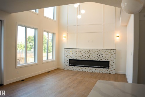 34 Mckenzie Close Close, Leduc, AB - Indoor Photo Showing Living Room With Fireplace