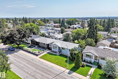 Contemporary-style single-story residence featuring a dark-toned exterior - 5519 142 Avenue Nw, Edmonton, AB - Outdoor With View