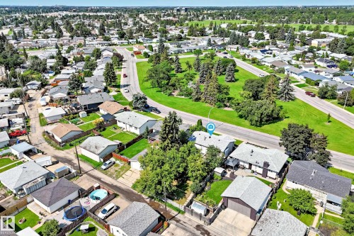 Aerial overview featuring residential architecture, established tree canopy, and green spaces - 5519 142 Avenue Nw, Edmonton, AB - Outdoor With View