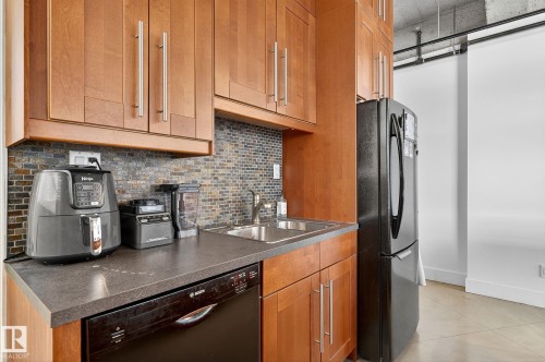 #201 10355 105 St Nw, Edmonton, AB - Indoor Photo Showing Kitchen With Double Sink