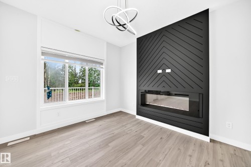 71 Patriot Way, Spruce Grove, AB - Indoor Photo Showing Living Room With Fireplace