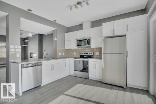 #13 13003 132 Av Nw, Edmonton, AB - Indoor Photo Showing Kitchen With Stainless Steel Kitchen
