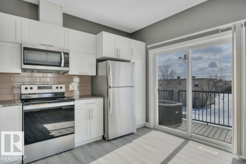 #13 13003 132 Av Nw, Edmonton, AB - Indoor Photo Showing Kitchen With Stainless Steel Kitchen