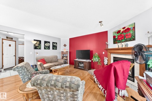 #204 4807 43A Av, Leduc, AB - Indoor Photo Showing Living Room With Fireplace