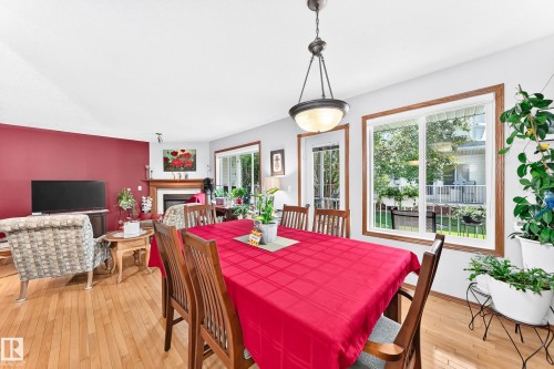 #204 4807 43A Av, Leduc, AB - Indoor Photo Showing Dining Room With Fireplace