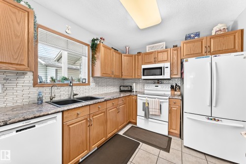 #204 4807 43A Av, Leduc, AB - Indoor Photo Showing Kitchen With Double Sink