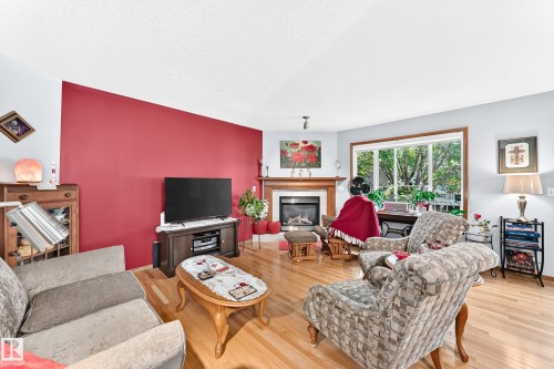 #204 4807 43A Av, Leduc, AB - Indoor Photo Showing Living Room With Fireplace