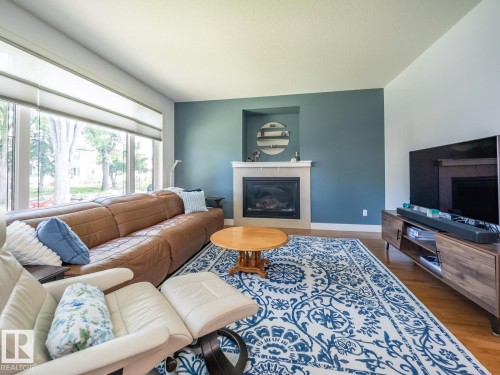 10957 75 Avenue Nw, Edmonton, AB - Indoor Photo Showing Living Room With Fireplace