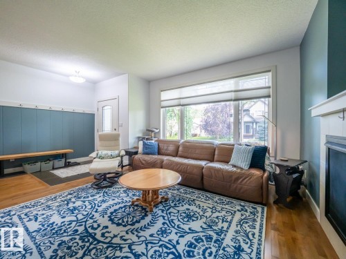 10957 75 Avenue Nw, Edmonton, AB - Indoor Photo Showing Living Room With Fireplace