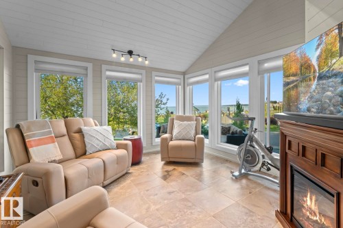 203 Pine Avenue, Cold Lake, AB - Indoor Photo Showing Living Room With Fireplace