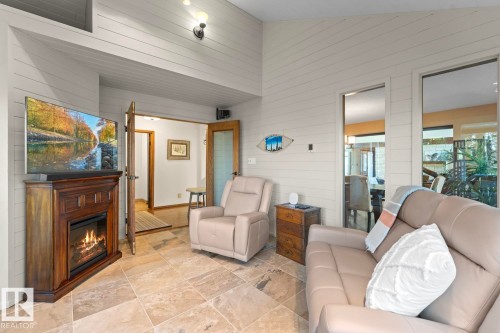 203 Pine Avenue, Cold Lake, AB - Indoor Photo Showing Living Room With Fireplace