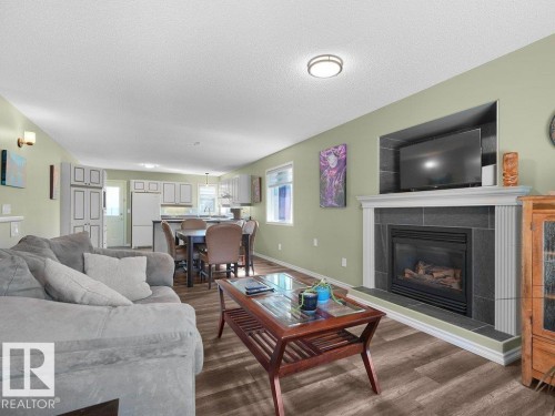 204 Westmews Drive, Fort Saskatchewan, AB - Indoor Photo Showing Living Room With Fireplace