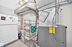 Utility area featuring an HVAC system and exposed ductwork - 