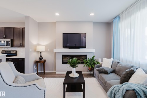 4331 Cooke Lane Sw, Edmonton, AB - Indoor Photo Showing Living Room With Fireplace