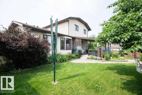 Two-story residence with light-colored siding and a brown roofline - 10711 108 Avenue, Westlock, AB - Outdoor