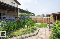 Covered patio with an exterior light fixture and double glass doors - 