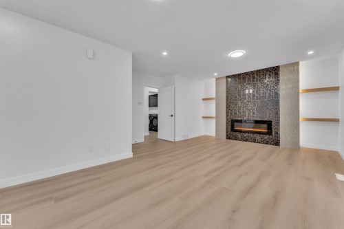 11615 24 Avenue Nw, Edmonton, AB - Indoor Photo Showing Other Room With Fireplace