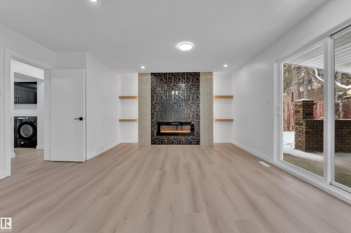11615 24 Avenue Nw, Edmonton, AB - Indoor Photo Showing Living Room With Fireplace