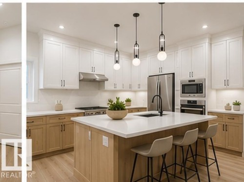 Modern kitchen featuring a central island with seating, white upper cabinetry, natural wood-finish lower cabinetry, stainless steel appliances, and wood-finish flooring - 3320 Chickadee Drive Nw, Edmonton, AB - Indoor Photo Showing Kitchen With Upgraded Kitchen