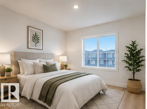 Bedroom featuring light wood-finish flooring, a large window, recessed lighting, and a neutral color palette - 3320 Chickadee Drive Nw, Edmonton, AB - Indoor Photo Showing Bedroom