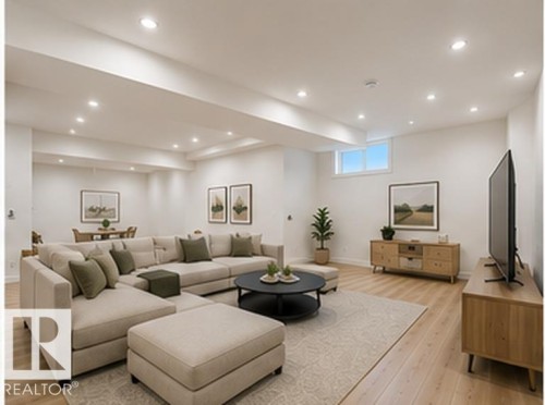 Recessed lighting illuminates this expansive space featuring light wood-finish flooring - 3320 Chickadee Drive Nw, Edmonton, AB - Indoor