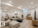 Recessed lighting illuminates this expansive space featuring light wood-finish flooring - 3320 Chickadee Drive Nw, Edmonton, AB  - Indoor 