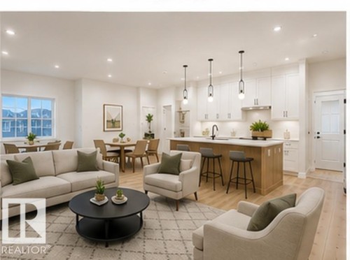 Open-concept living space featuring wood-finish flooring, recessed lighting, and a kitchen island with seating - 3320 Chickadee Drive Nw, Edmonton, AB - Indoor Photo Showing Living Room