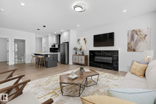 4603 36 Street, Beaumont, AB - Indoor Photo Showing Living Room With Fireplace