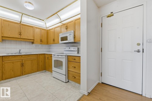#208 9926 100 Av, Fort Saskatchewan, AB - Indoor Photo Showing Kitchen With Double Sink