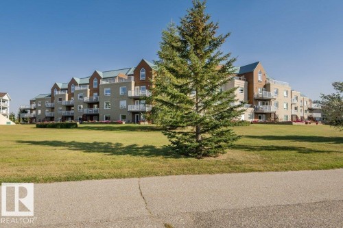 #208 9926 100 Av, Fort Saskatchewan, AB - Outdoor With Balcony With Facade