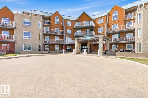 #208 9926 100 Av, Fort Saskatchewan, AB - Outdoor With Balcony With Facade