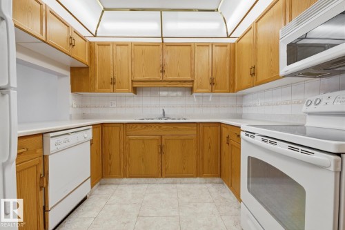 #208 9926 100 Av, Fort Saskatchewan, AB - Indoor Photo Showing Kitchen With Double Sink