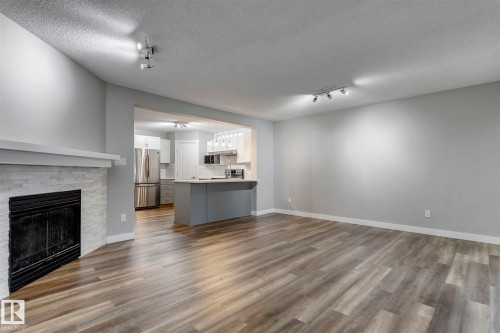 15819 69 Street Nw, Edmonton, AB - Indoor Photo Showing Living Room With Fireplace