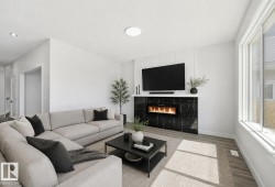Spacious living area featuring a modern fireplace with a dark, textured surround - 